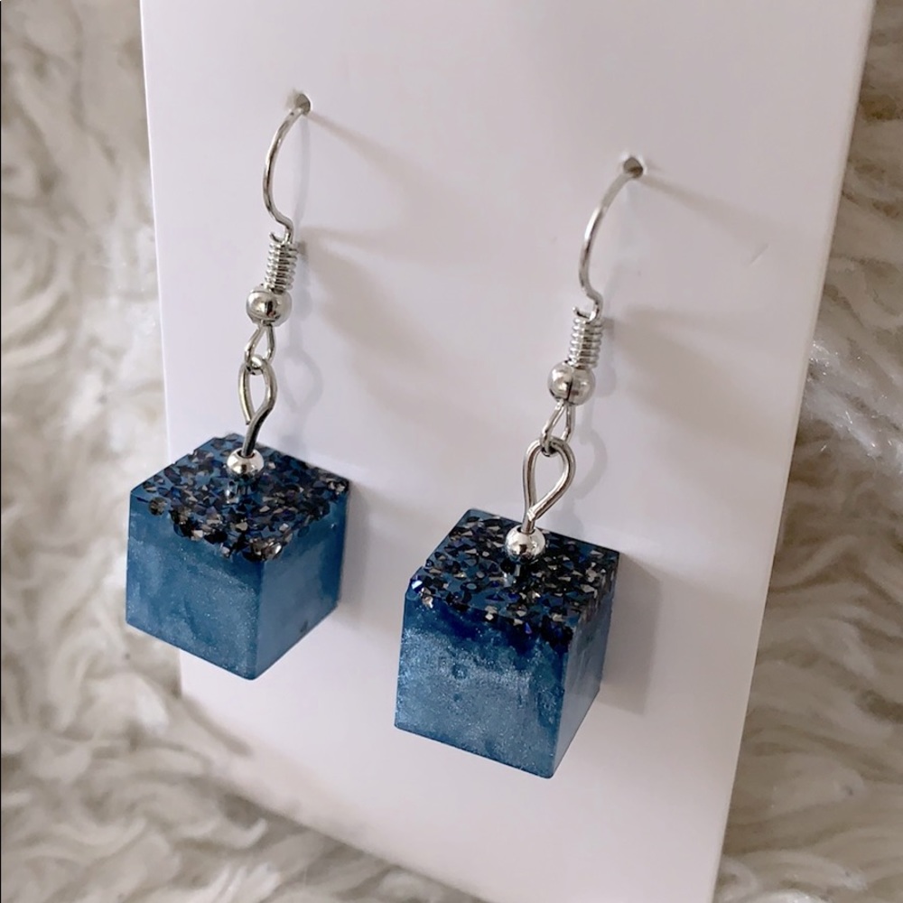 Pearlescent blue cube earrings.